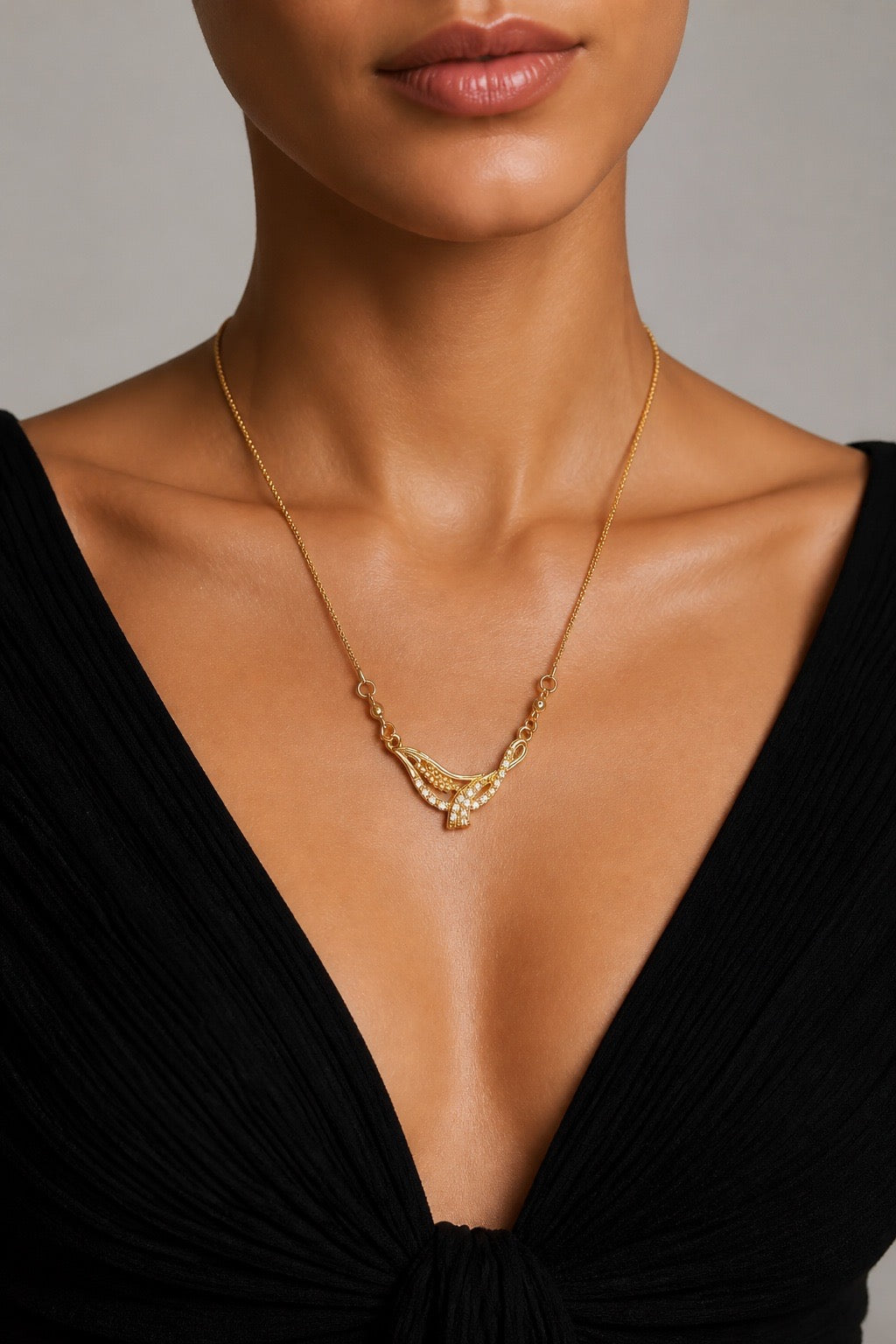 CRYSTAL INFINITY KNOT PENDANT NECKLACE